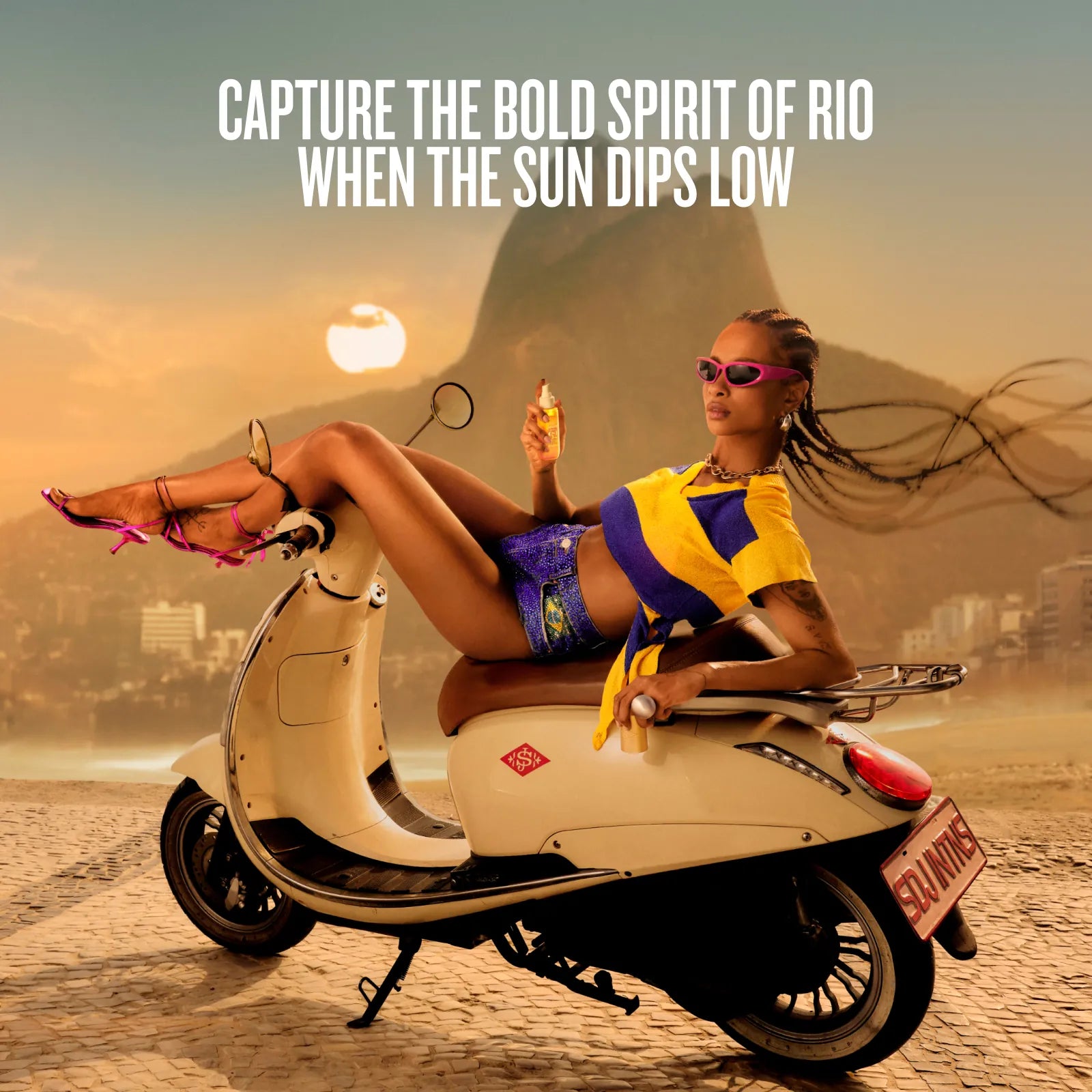 A woman reclining on a cream-colored scooter on a beach with a warm sunset sky, large text at the top reading &