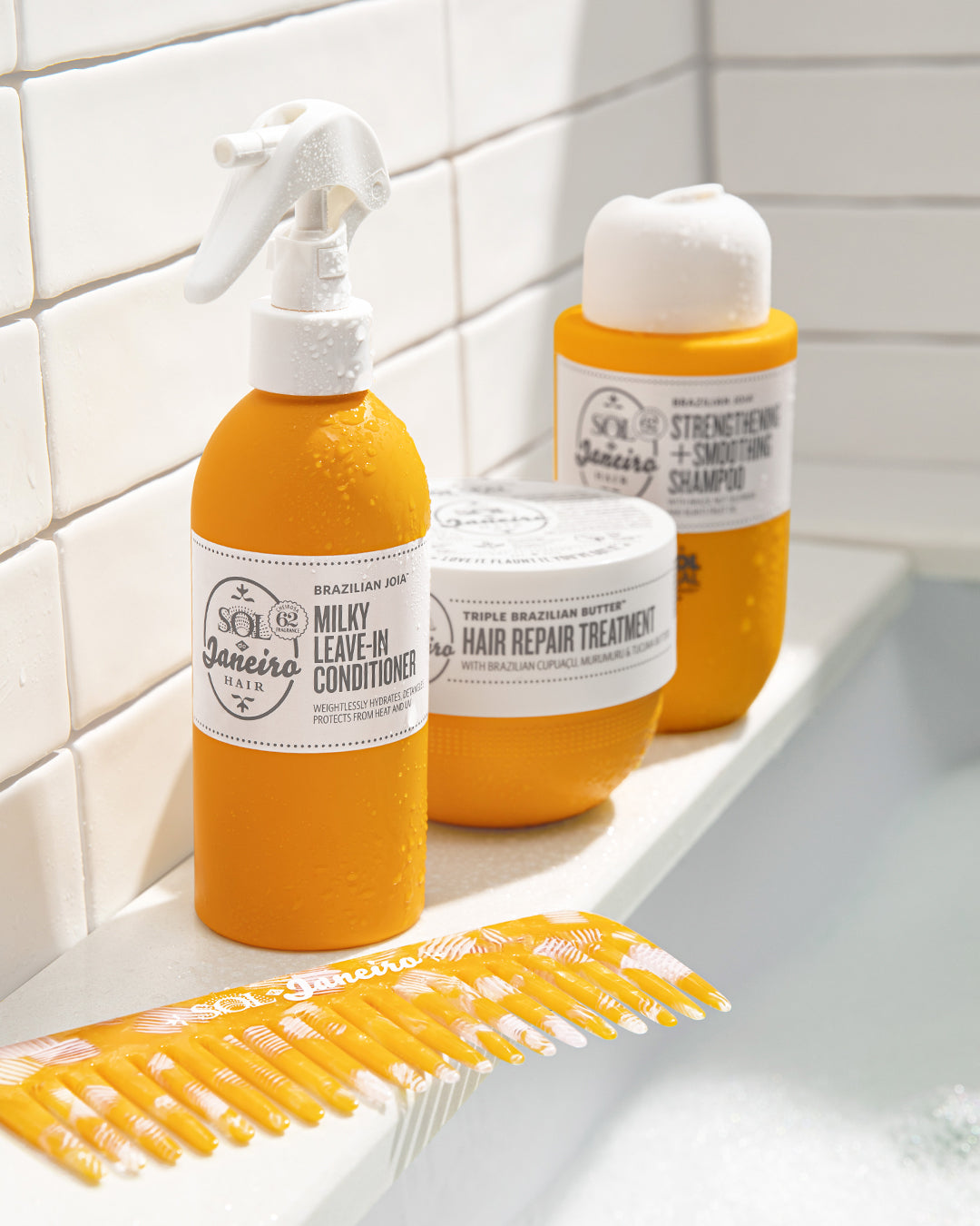 milky leave in conditioner, hair mask and shampoo with comb in the shower