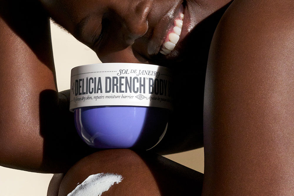 Delicia Drench Body Butter with model smiling