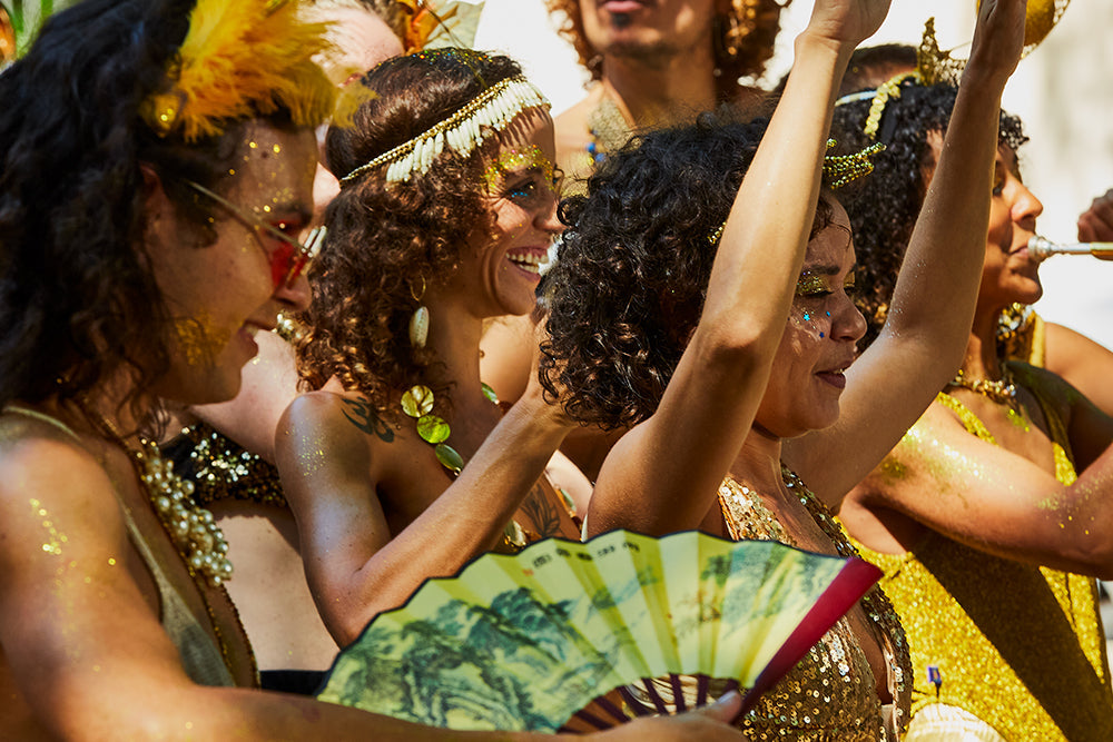 Brazilian wearing Samba Costume. Beautiful Brazilian woman wearing colorful costume and smiling during Carnaval street parade in Brazil.