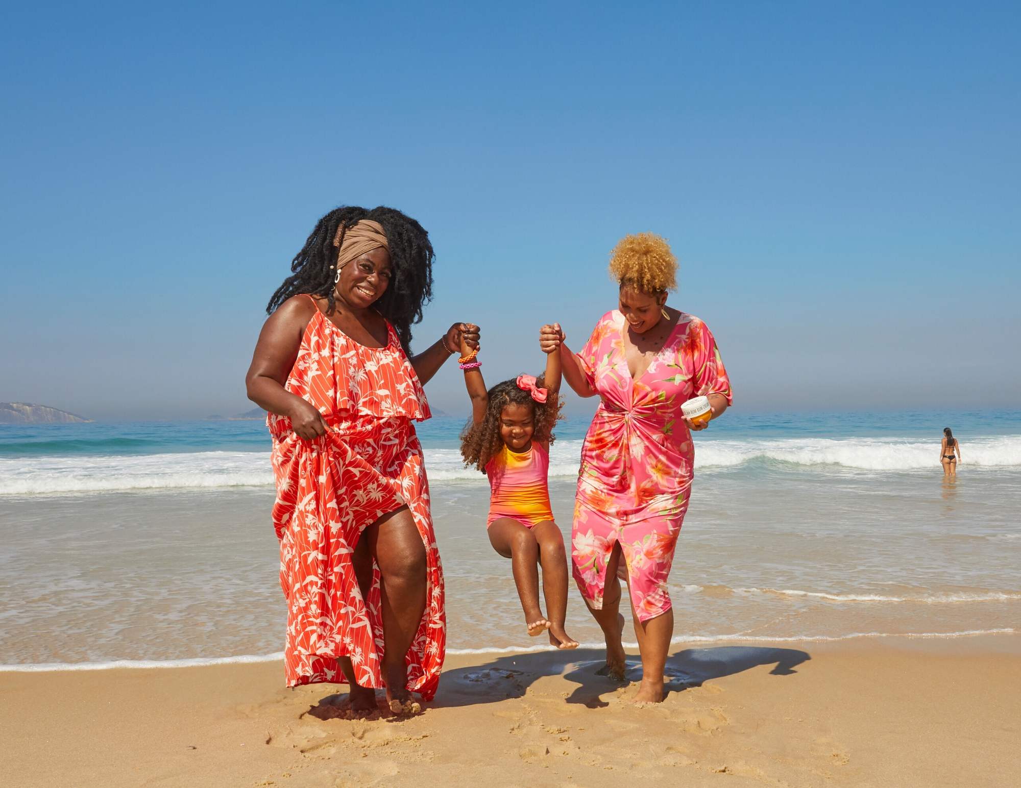 Brazilian grandmother, mother and daughter on the beach