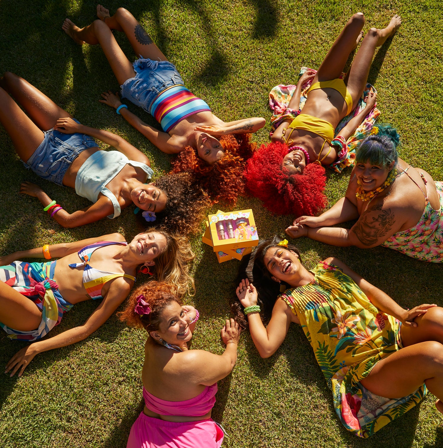 Group of people laying down on grass
