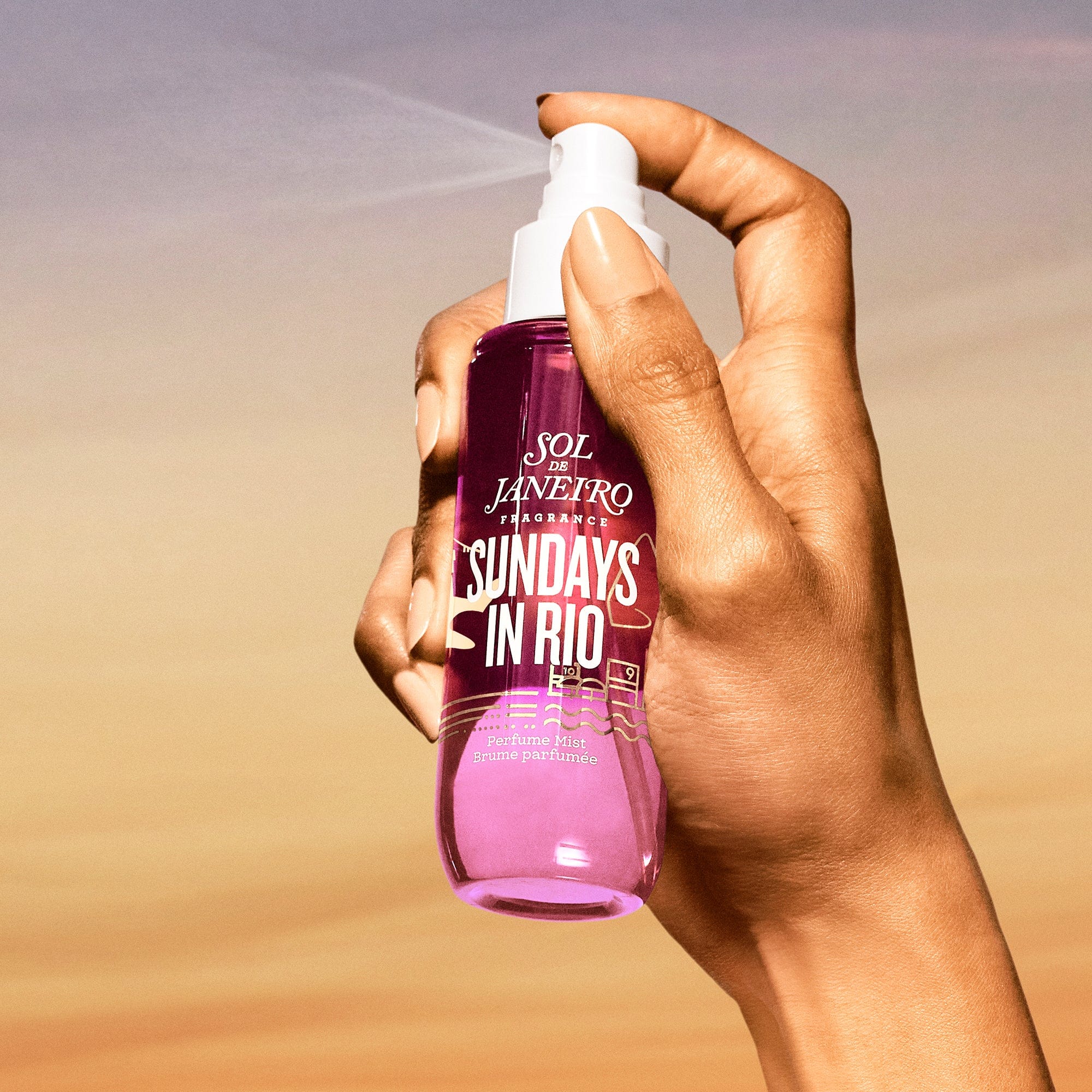 Model spraying sundays in rio perfume mist 90ml render into the sky. The background is a pretty sunset 