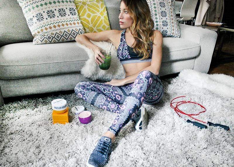 Lauren Gould sitting with jump rope, green smoothie, Brazilian Bum Bum Cream, Açaí Body Power Cream