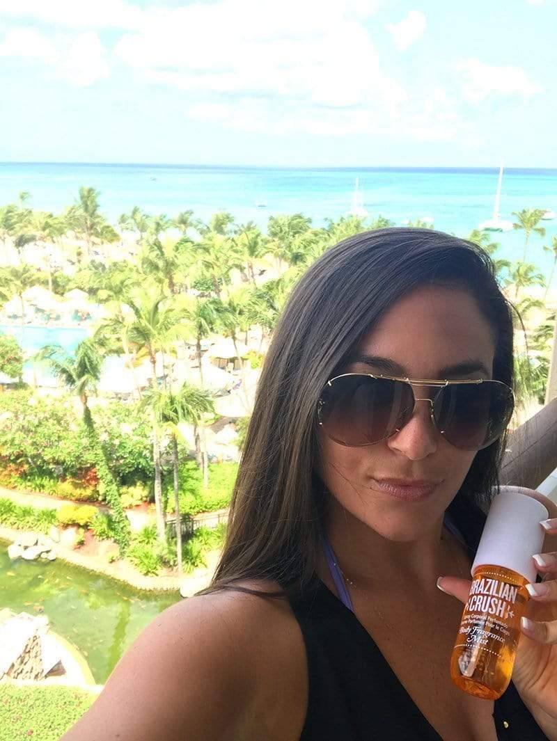 Samantha Giancola holding Brazilian Crush Body Fragrance Mist