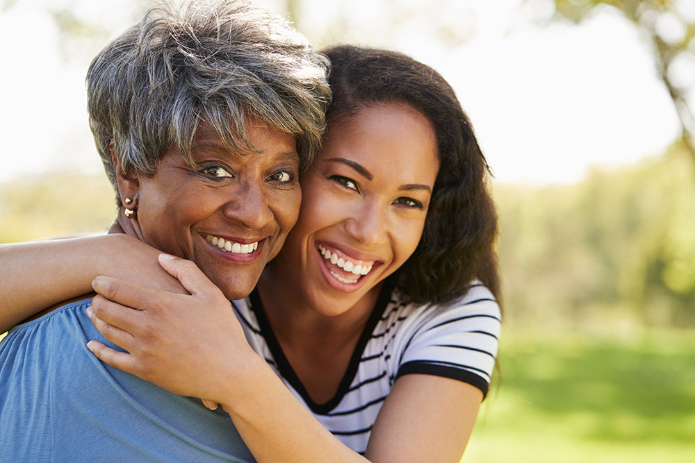 Mother and daughter hugging