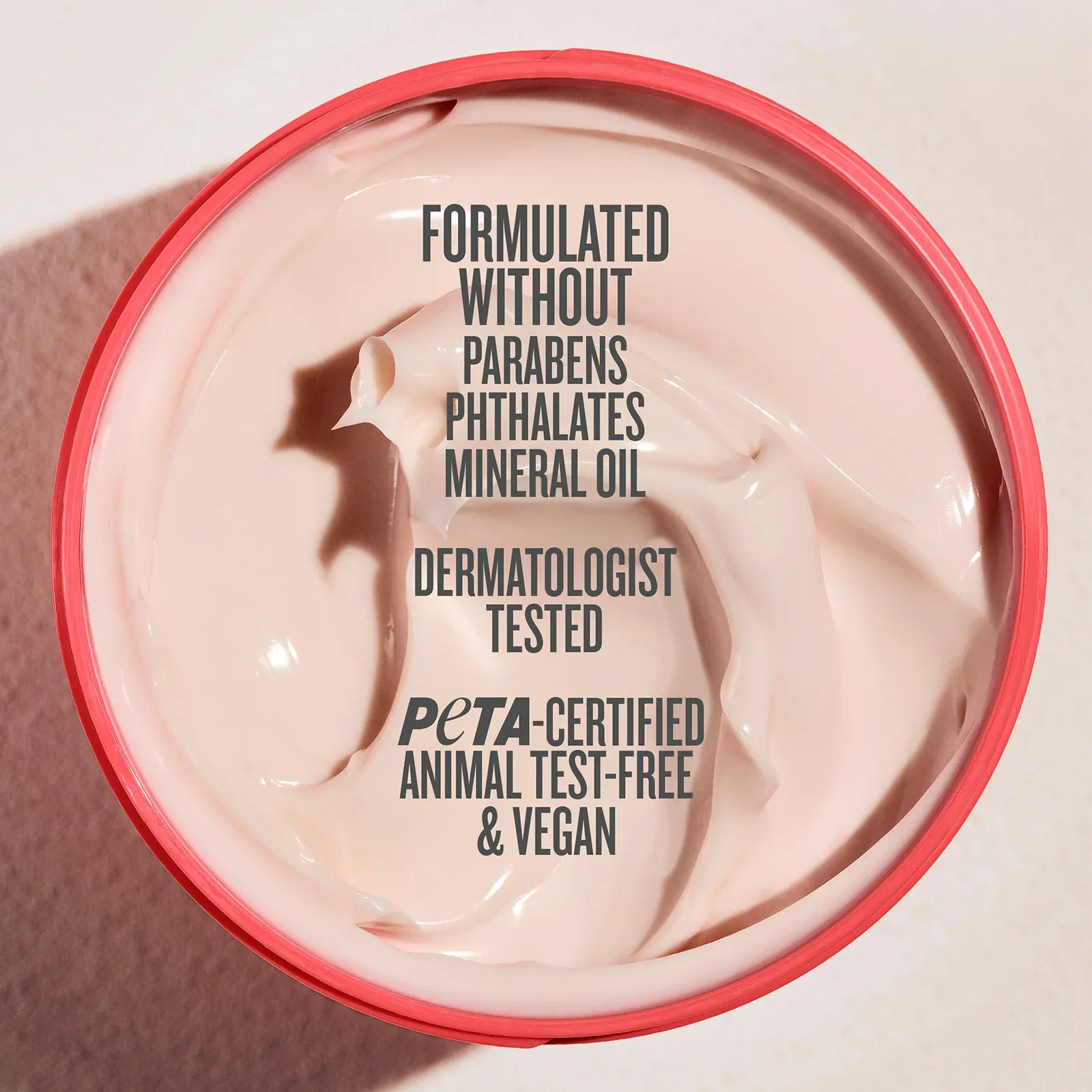 Cosmetic product with text about ingredient-free and ethical claims on a light background

Formulated without parabens, phthalates, mineral oil, dermatologist tested, peta-certified animal test-free & vegan