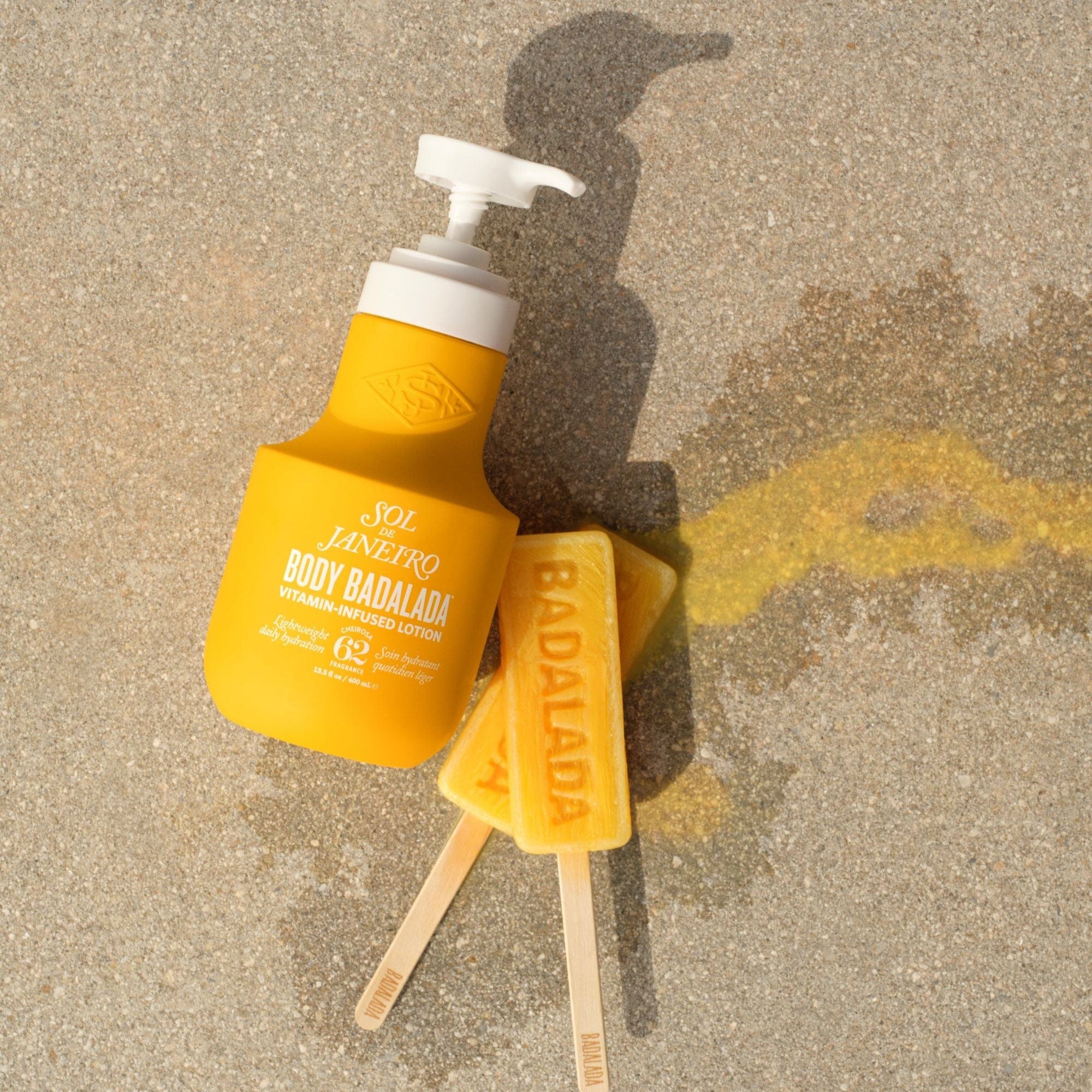 badalada lotion on the beach in sand