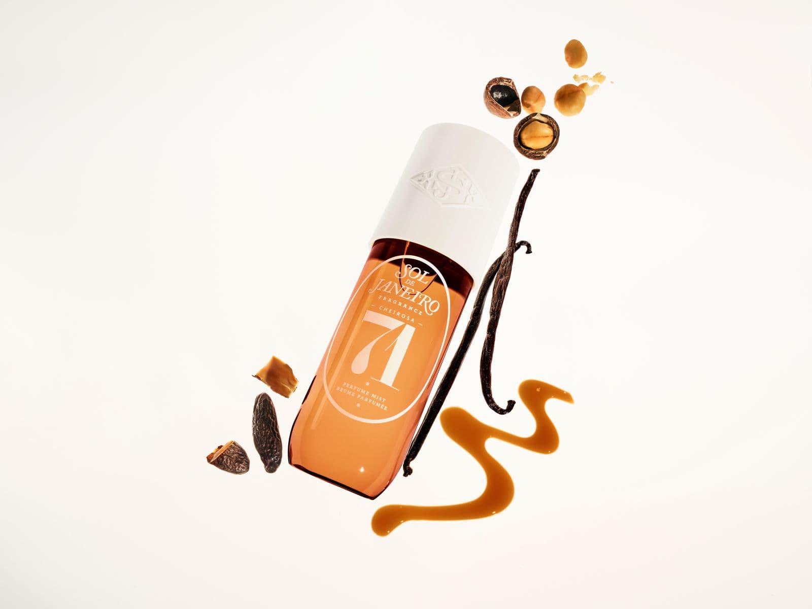 Vanilla extract bottle with vanilla beans and syrup on a white background