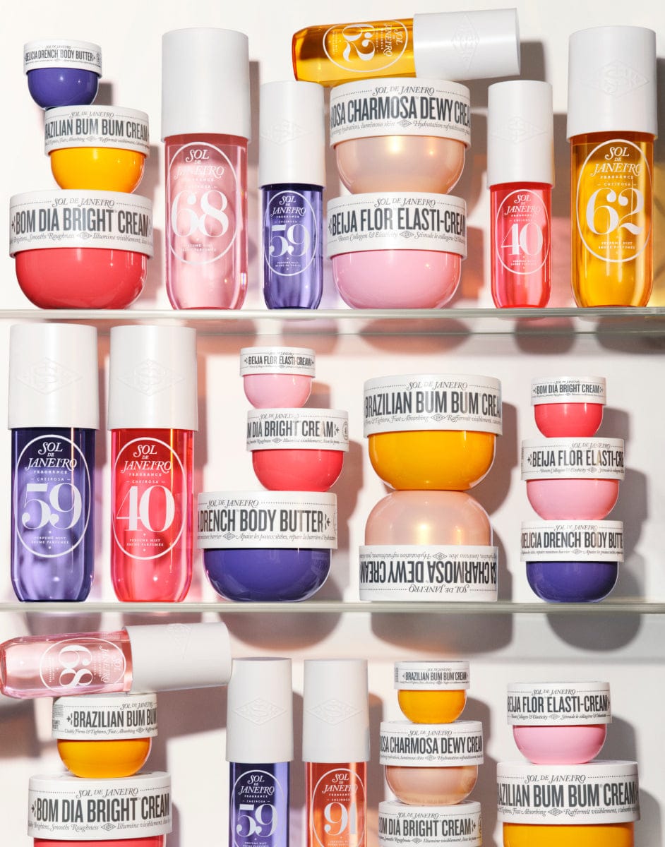 Shelf displaying various cosmetic products with visible branding.