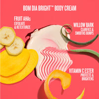 BOM DIA BRIGHT Body Cream smear with banana slices, yellow citrus peel, and green willow bark peel on a bright pink background with product benefits text.