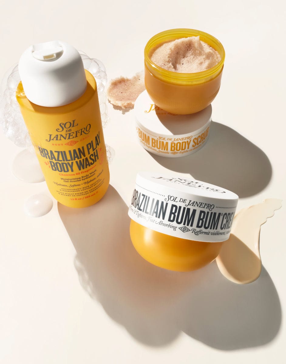 Three Brazilian Bum Bum products including a bottle, jar, and cream on a light background