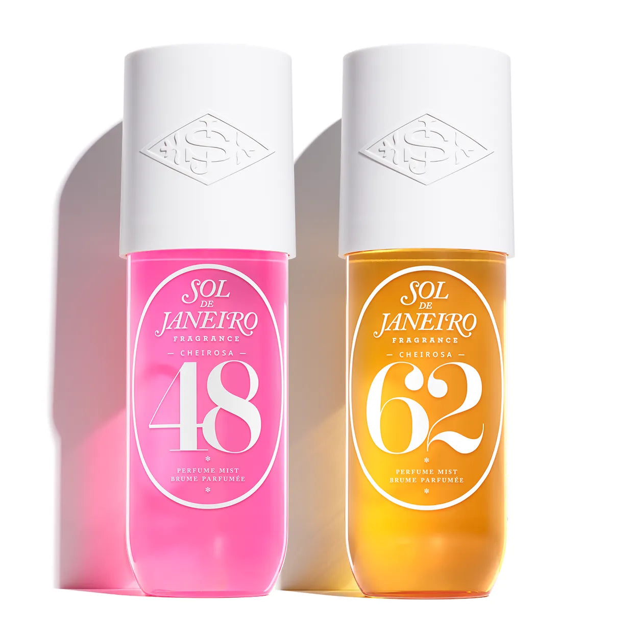 Two Sol de Janeiro perfume bottles, one pink and one orange, on a white background.