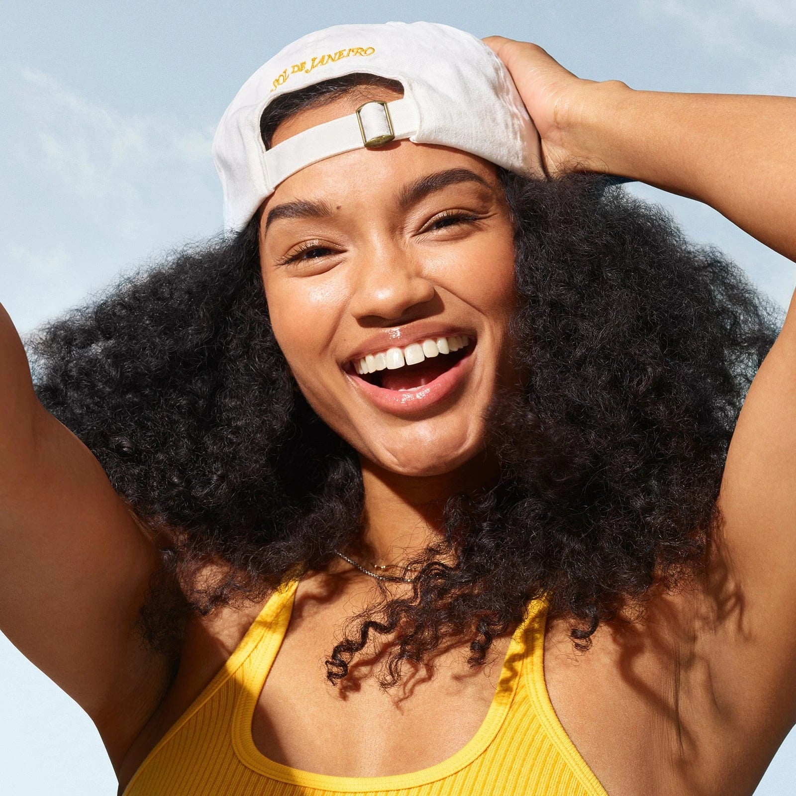 Another model (female), wearing the badalada baseball hat backwards