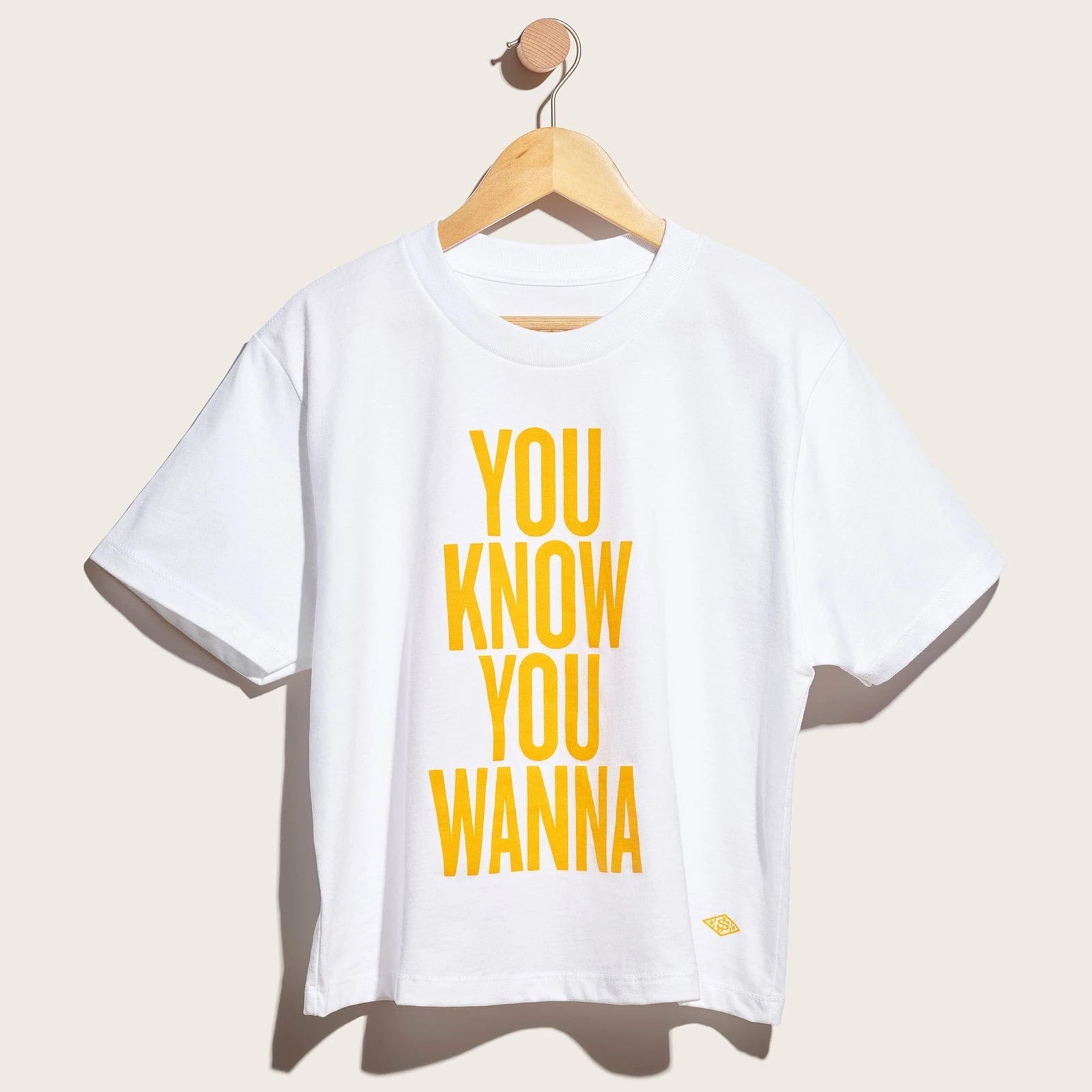 Sol de janeiro t-shirt, reads "you know you wanna"