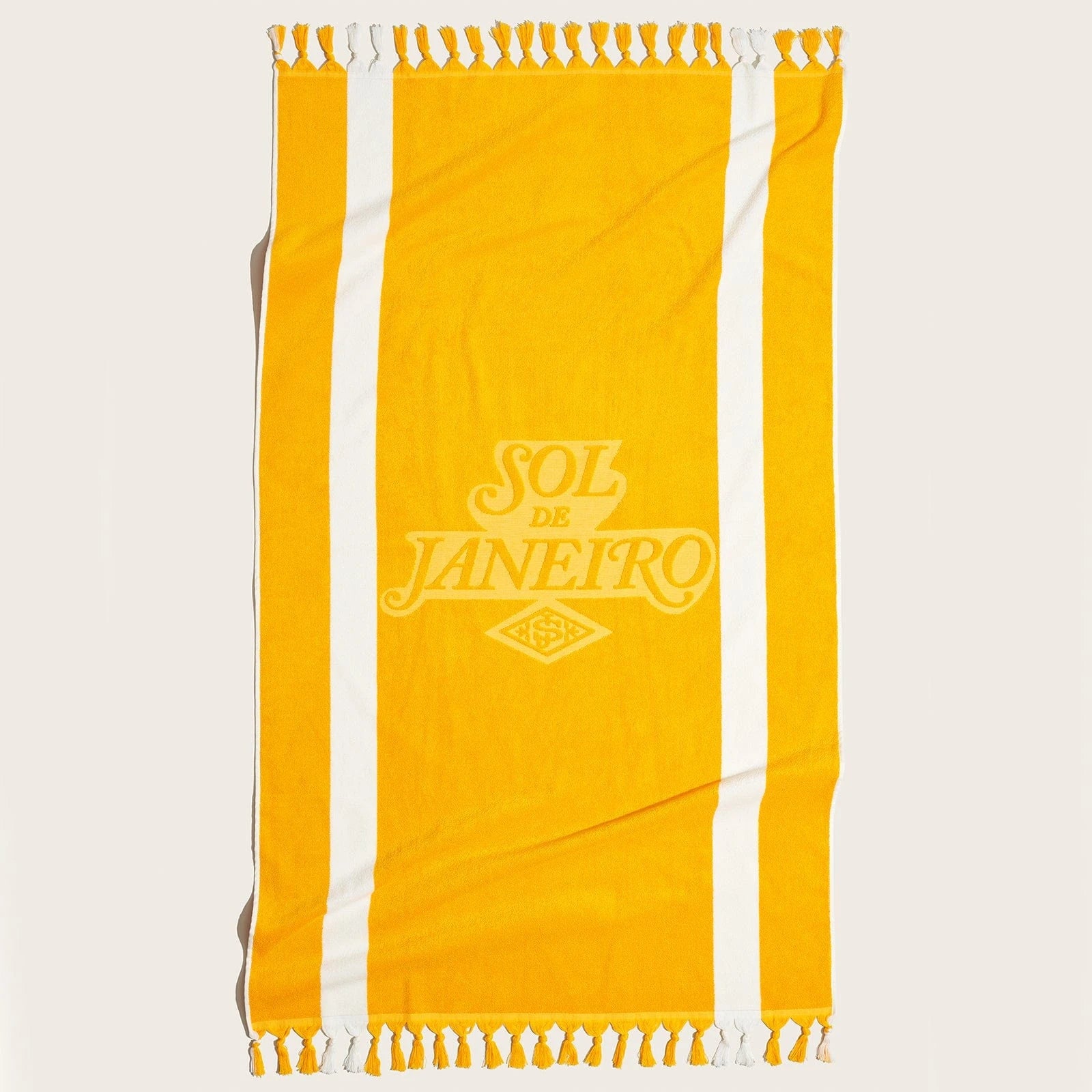 Sol de Janeiro Body Badalada Beach Towel Render. Beach towel is in sol de janeiro yellow