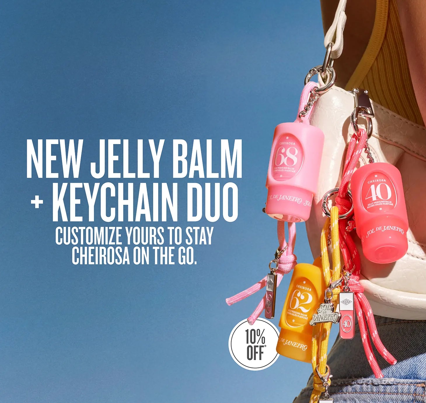 A promotional close-up of a person carrying a white shoulder bag with multiple pink and yellow hand sanitizer keychain bags attached. Large text on the left reads 'NEW JELLY BALM + KEYCHAIN DUO' and 'CUSTOMIZE YOURS TO STAY CHEIROSA ON THE GO.