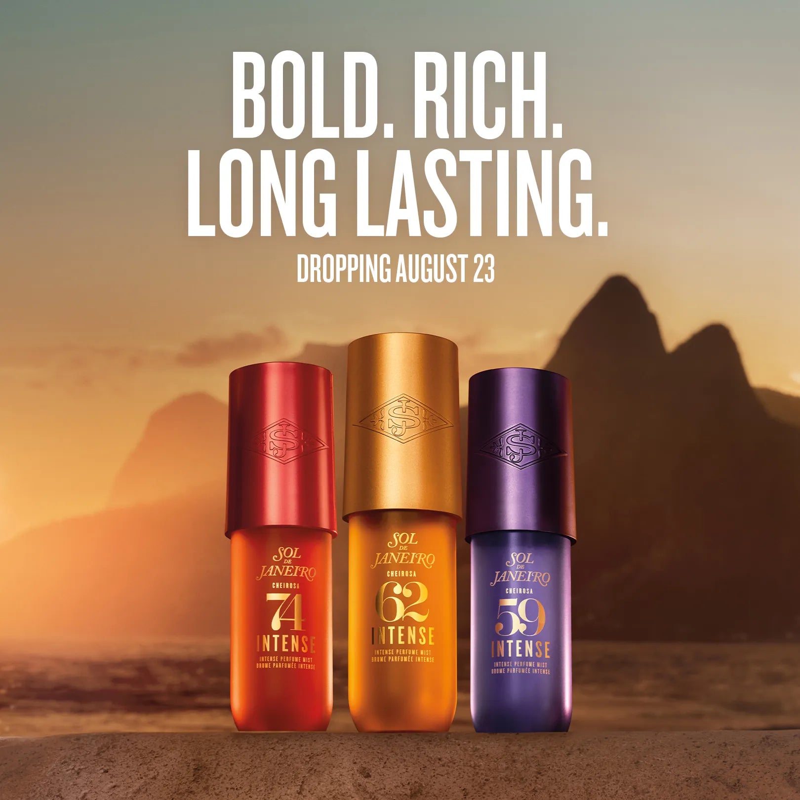 Three Jol Jenner Pro Intense sunscreen bottles in red, gold, and purple stand on a desert landscape with large text above reading 'BOLD. RICH.
