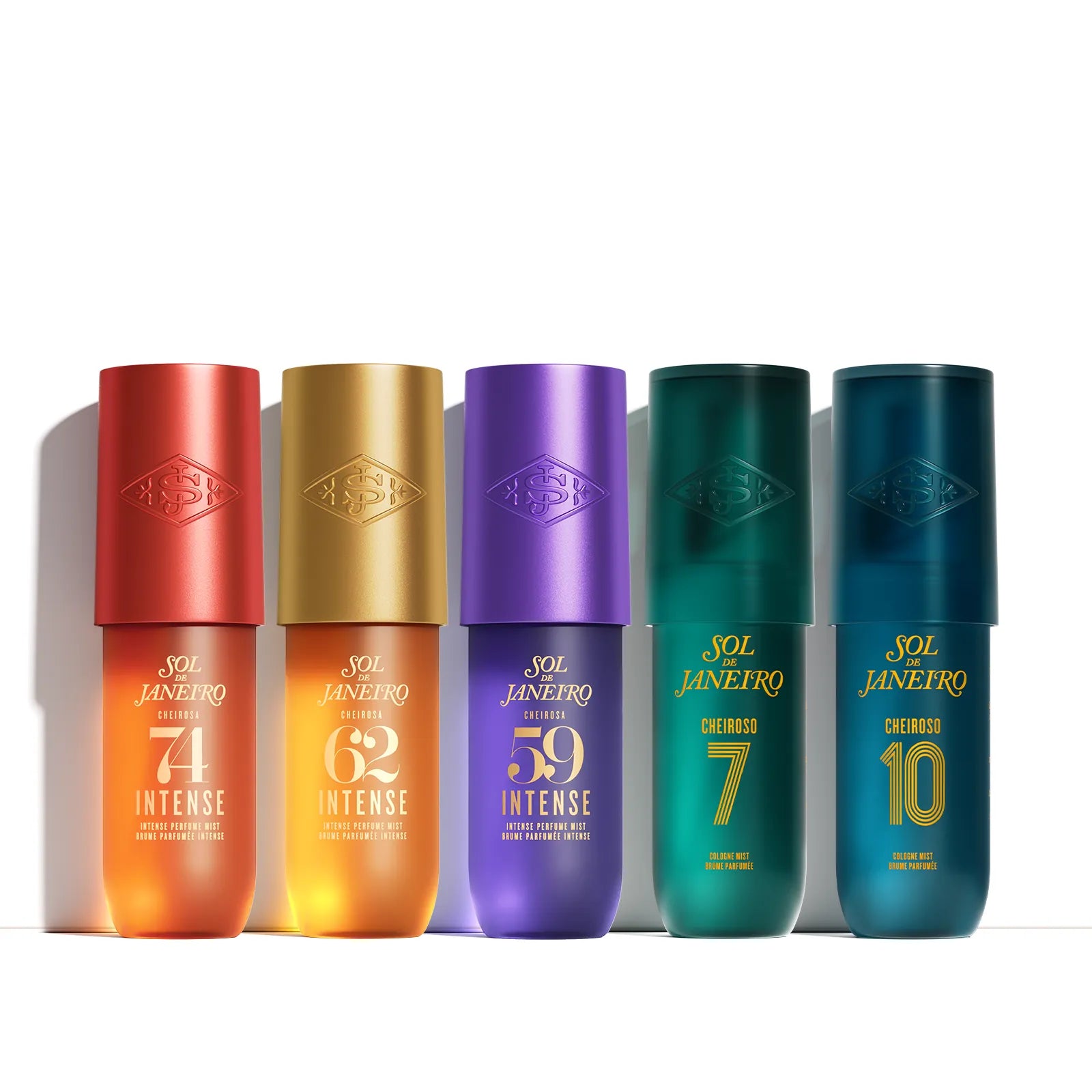 Five cylindrical cosmetic bottles from Sol Janeiro Intense Care arranged in a row on a white background. The bottles have metallic caps in red, gold, purple, green, and blue, with gold text displaying shade numbers 74, 62, 59, 7, and 10.