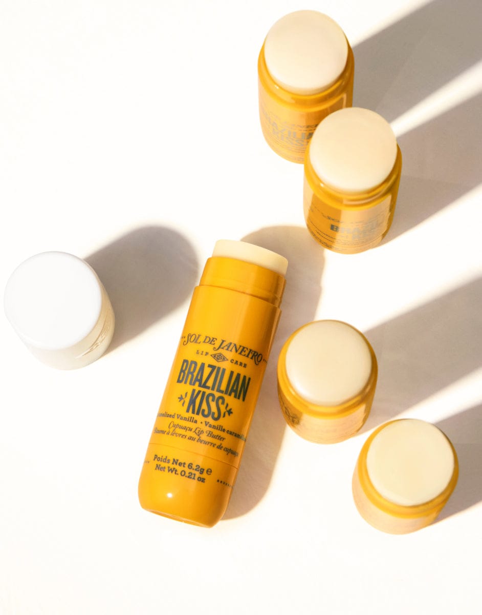 Yellow bottles with white caps on a white background