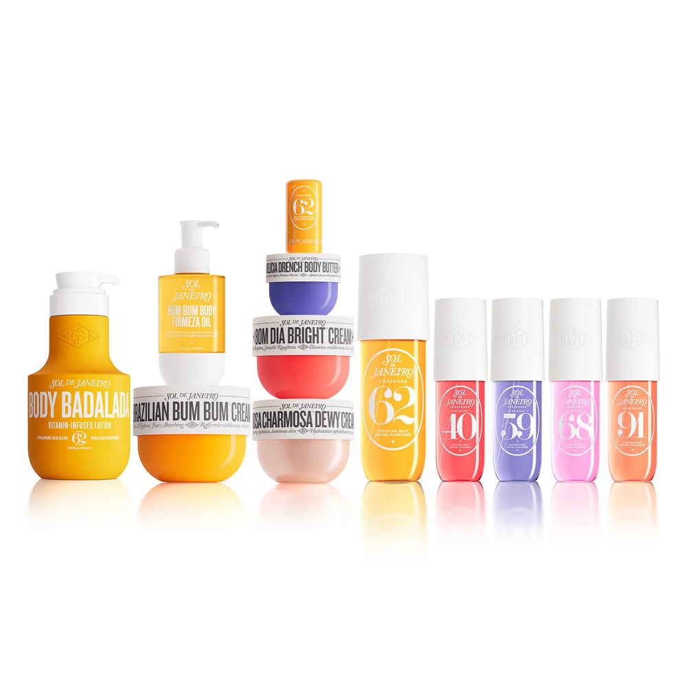 A lineup of VEA JEANROE body care products on a clean white background, featuring various bottles and jars in vibrant yellow, orange, pink, purple, and white packaging.
