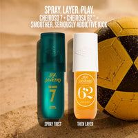 Two bottles of Sol Janeiro Cheiroso 7 and Cheiroso 62 perfume spray standing side by side on a sandy surface, with a yellow and black soccer ball in the background. White text at the top reads 'SPRAY.