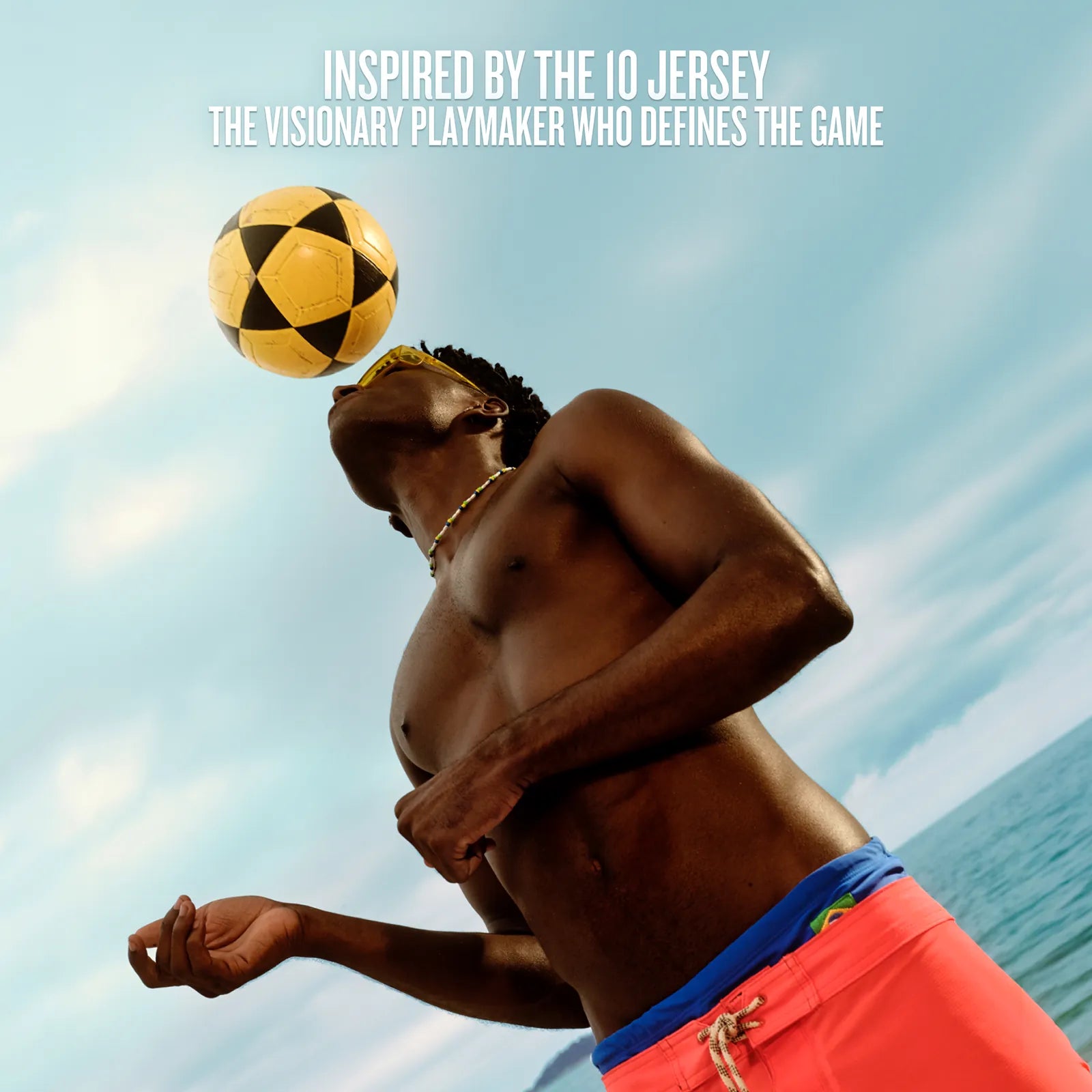 Man playing with a soccer ball against a blue sky background, inspired by the 10 jersey.