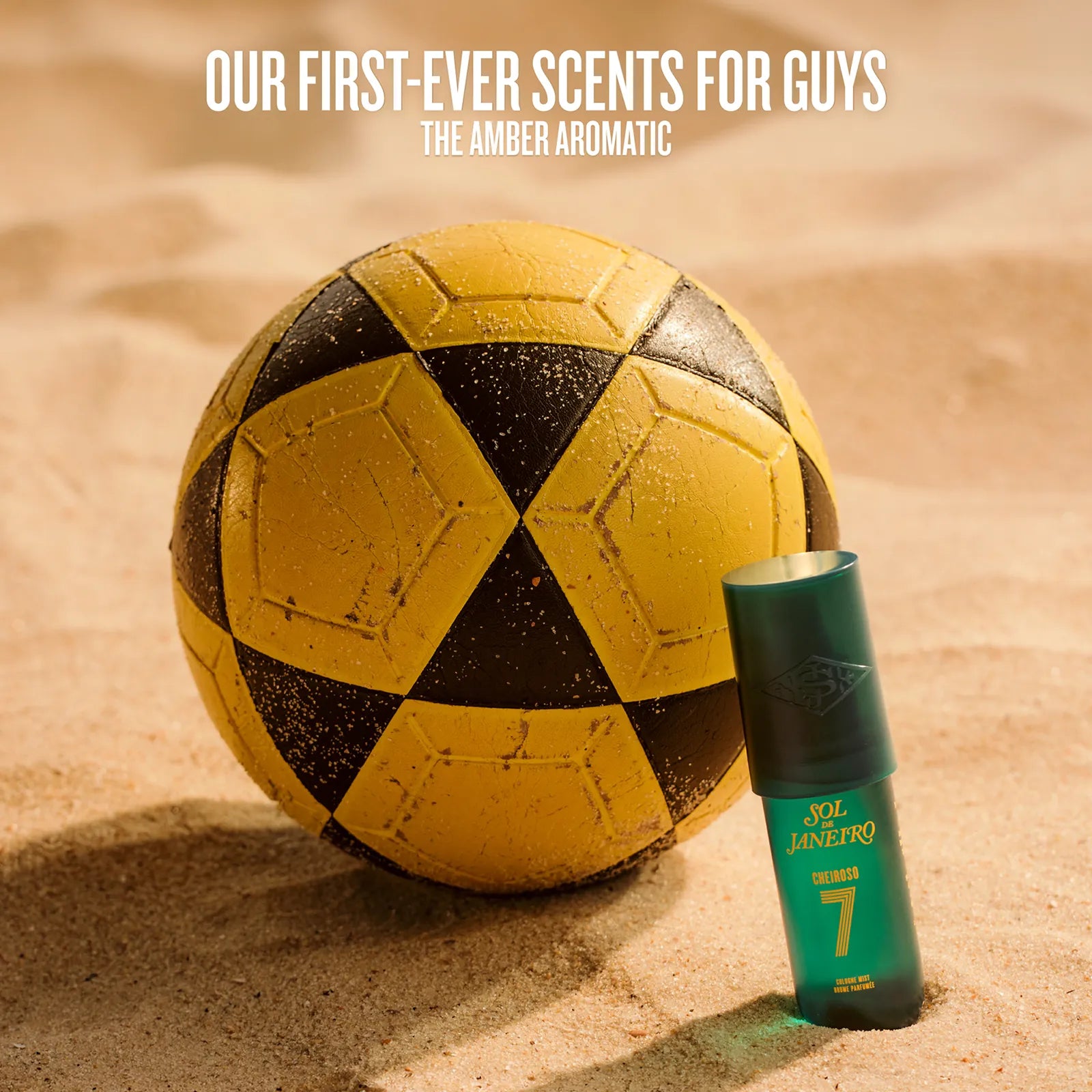 Yellow and black soccer ball with a green and black bottle on sand, featuring text about new fragrances for men.