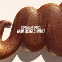 Text on image reads copacabana bronze warm bronze shimmer. This is a close up of a goop product shot of sol de janeiro glowmotions glow body oil in copacabana bronze