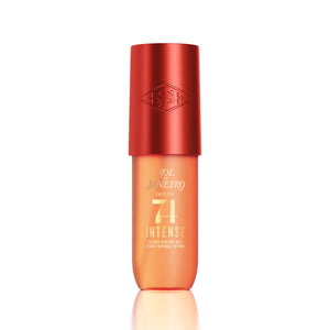 Sol Janetro Calmelis 74 Intense Healthy Power Face Serum in a translucent orange bottle with a metallic red cap, shown on a white background with a soft reflection.