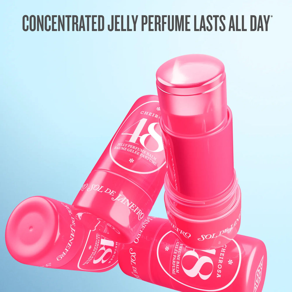 Four pink Sol de Janeiro Cherry 18% jelly perfume stick containers arranged on a light blue gradient background, with the text 'CONCENTRATED JELLY PERFUME LASTS ALL DAY' at the top.