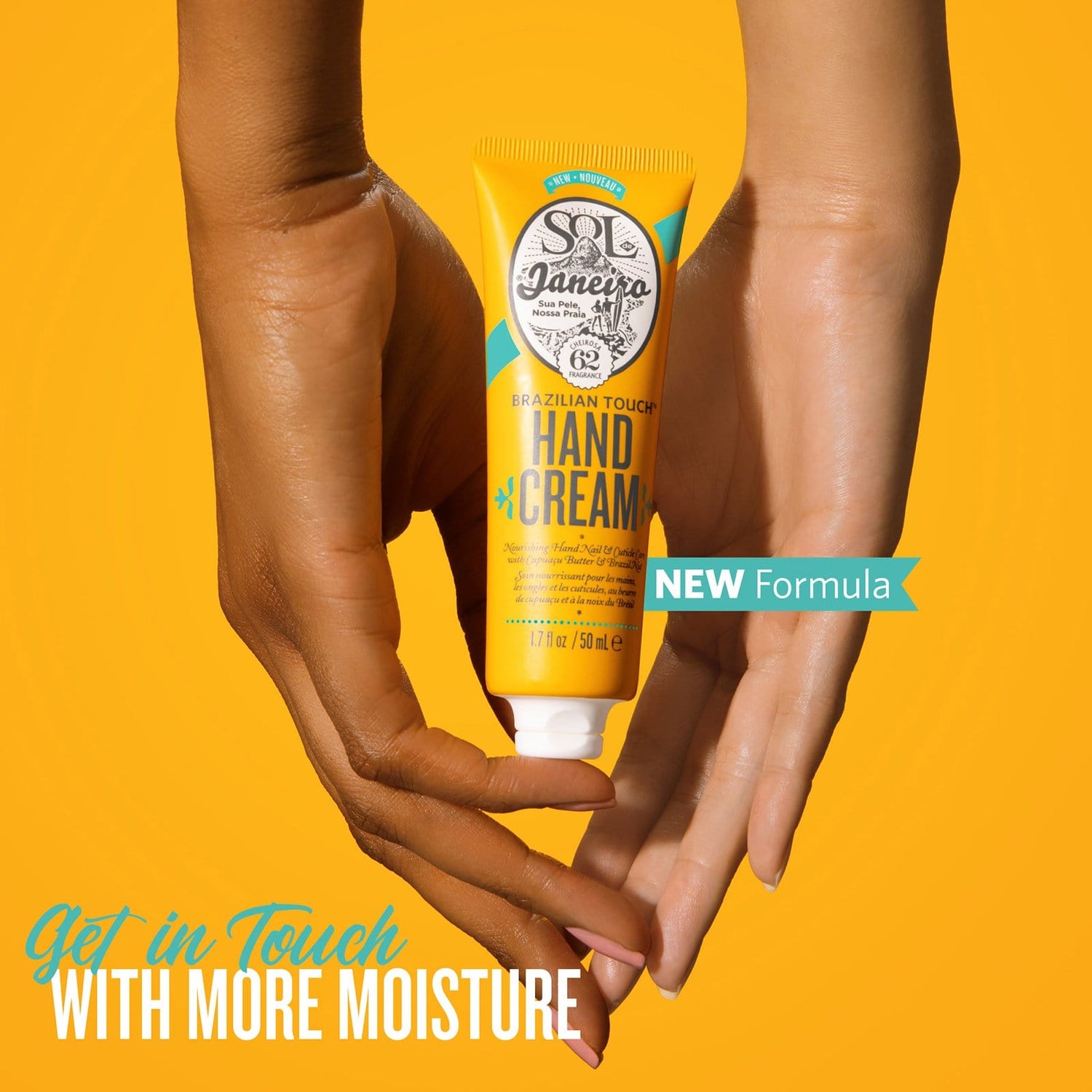 hands holding  Brazilian Touch Hand Cream, Sol de Janeiro. New Formula. Get in Touch with more Moisture